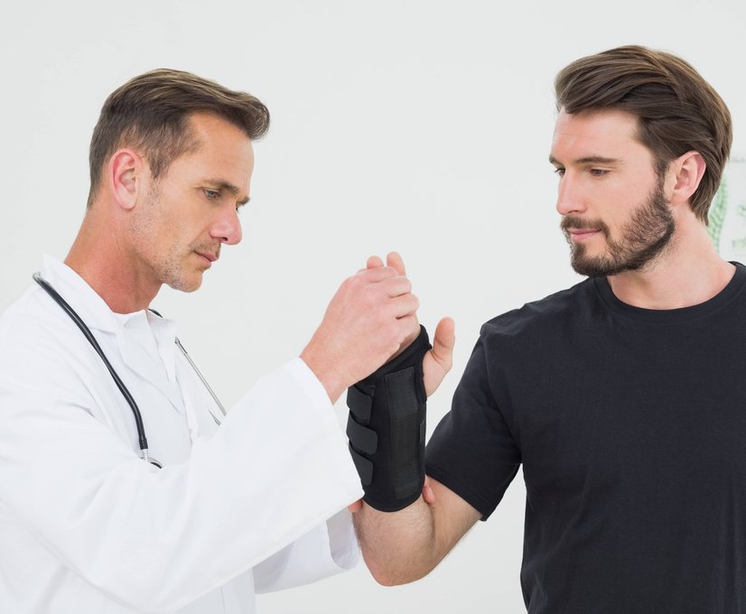 Two men having a discussion in a clinical setting