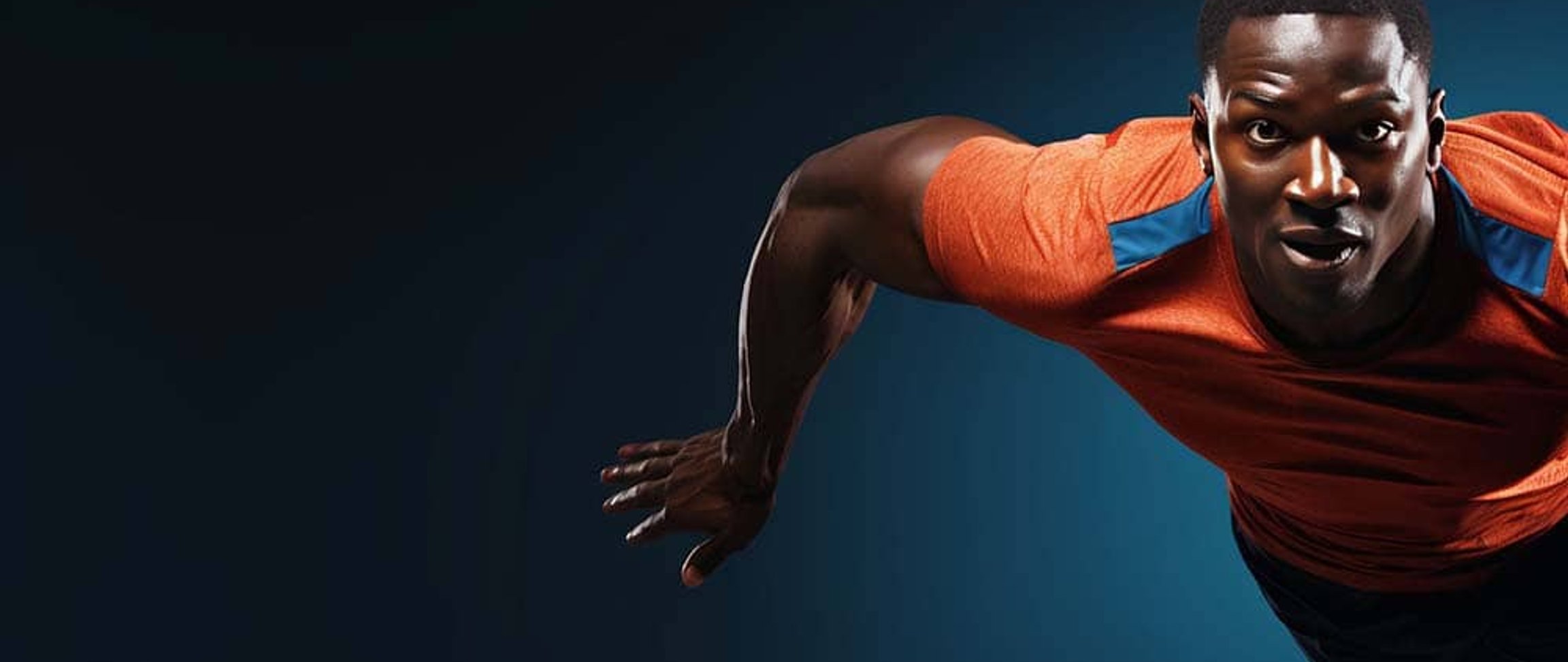 Athlete stretching under spotlight