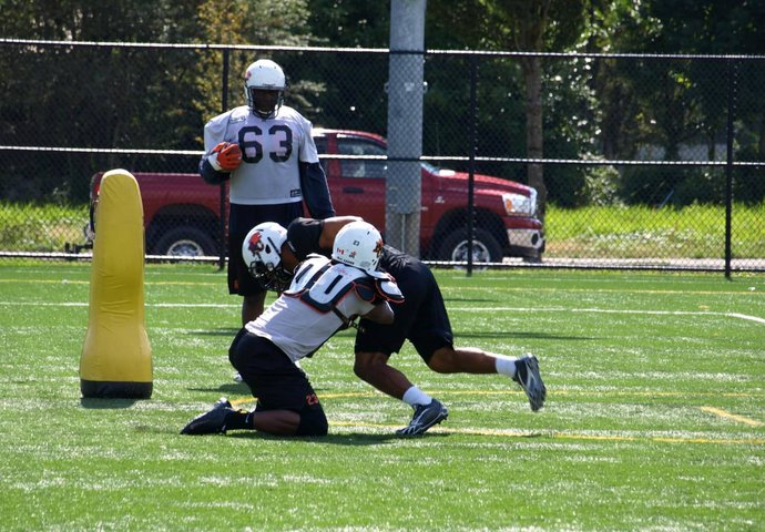 Football players colliding during match